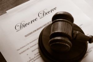 Legal gavel on top of divorce papers