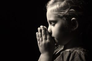 Praying child.