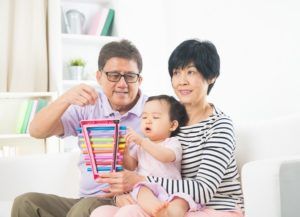 asian grand parents with crying grand daugther